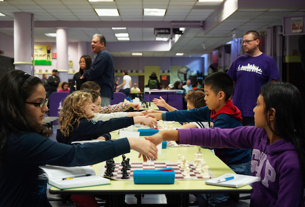 Students playing chess online
